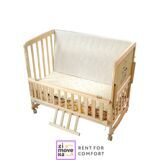 Wooden crib with mattress