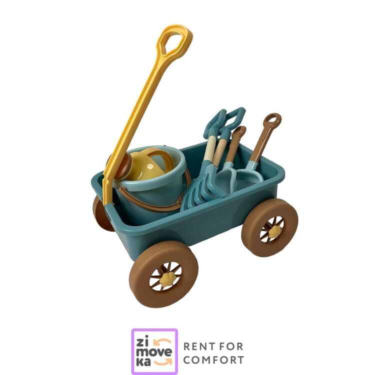 Beach cart with shovels, watering can, bucket, rakes